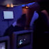 Fellow fliers jumped in to help flight attendants after claims the passengers had a gun and threatened to kill.