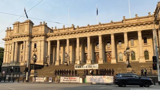 An antisemitic sign is held on the steps of Victoria’s parliament.