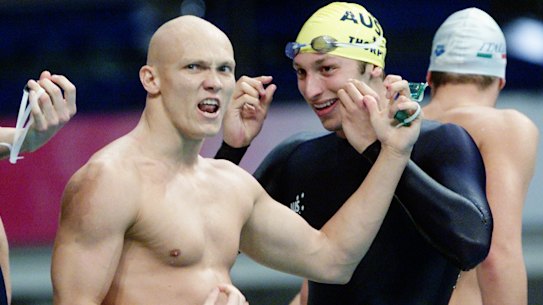 Michael Klim performs his air guitar celebration alongside Ian Thorpe and his Australian teammates after beating the US to take gold.