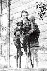 Where it all began: A young Donald with his terrier, Teddy, at his childhood home in Bowral.