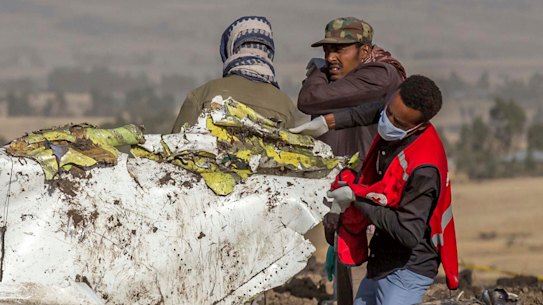 Rescue workers comb the scene of the Ethiopian Airlines crash.