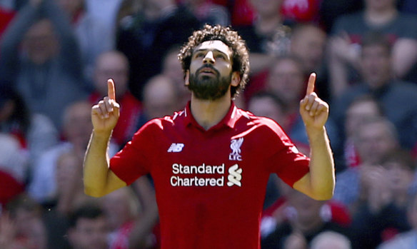 Liverpool's Mohamed Salah celebrates scoring his side's first goal against Brighton & Hove Albion at Anfield.