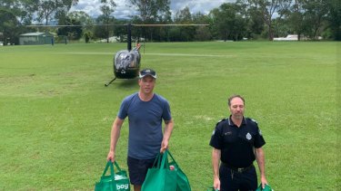 Helicopters were used to fly in supplies to the Moggill and Bellbowrie sections of the Ryan electorate during the recent floods.