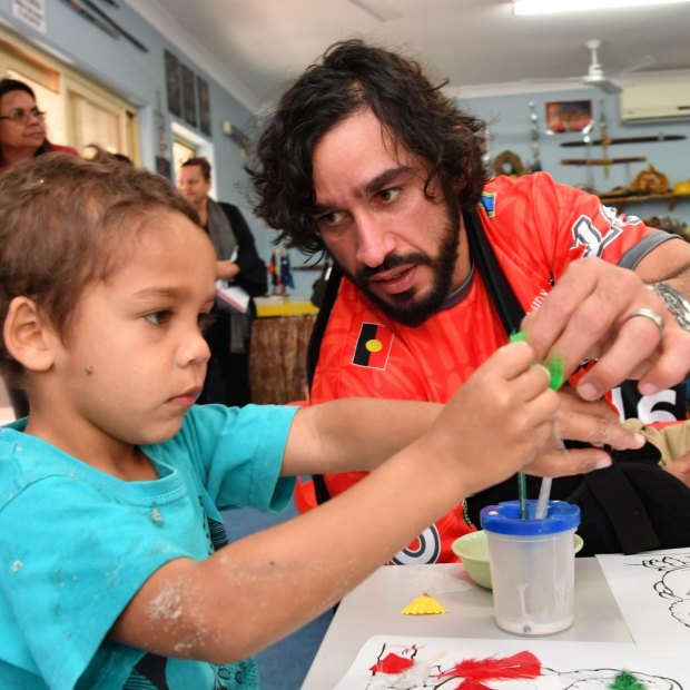'That’s the one thing that I regretted; that I didn’t apply myself (at school) to have something to fall back on.' Johnathan Thurston with children from the Camp Koobara Aboriginal and Torres Strait Islander Kindergarten in Brisbane. 