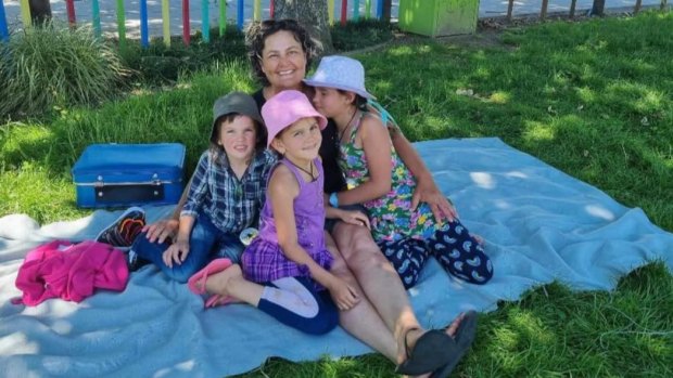 Cat, with her three children in 2021, a month before they were taken by their father, Tom Phillips.