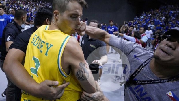 Boomers player Andrew Sobey is punched in the face during the extraordinary brawl in the Philippines.