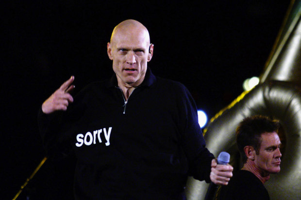 Midnight Oil singer Peter Garrett says “Sorry” at the 2000 Olympics.