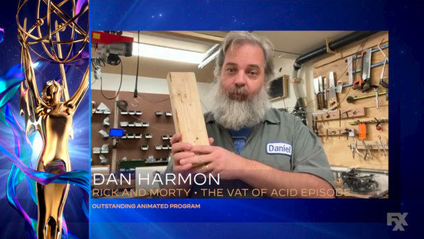 Phoning it in ... Dan Harmon uses a block of wood as an imaginary Emmy during his acceptance speech in 2020.