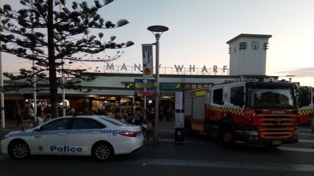 Police and firefighters respond to a threat at Manly Wharf. 