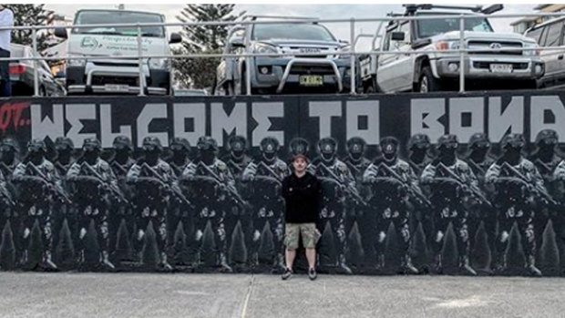 Luke Cornish with the mural before it was defaced. 