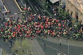 Stills from helicopter footage of the protest on Tuesday outside the CFMEU headquarters in Melbourne.