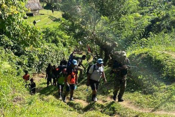 PNG defence personnel escorting the prime ministers’ entourage on the Kokoda Track. 