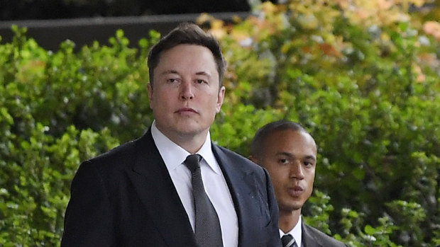 Elon Musk arrives at the US District Court in Los Angeles. He says he is asset rich, but cash poor.