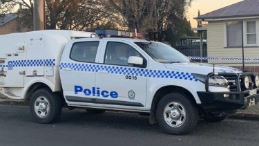 Police attend the scene of the child's death. 
