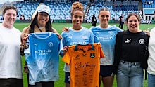 Mary Fowler and Kerstin Casparij with Wallaroos players.