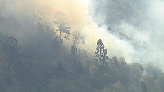 The Sarabah blaze in the Scenic Rim region broke containment lines on Friday and residents were told to prepare to flee.