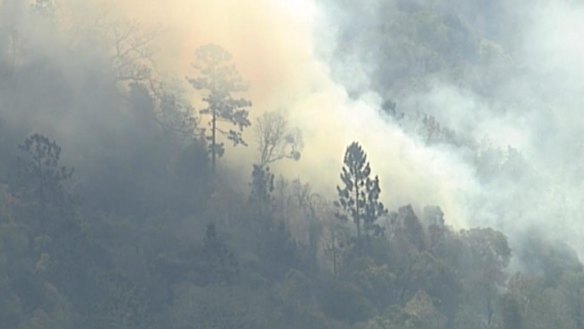 The Sarabah blaze in the Scenic Rim region broke containment lines on Friday and residents were told to prepare to flee.