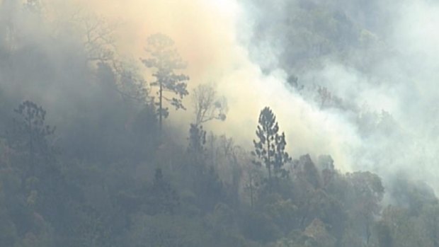 The Sarabah blaze in the Scenic Rim region broke containment lines on Friday and residents were told to prepare to flee.