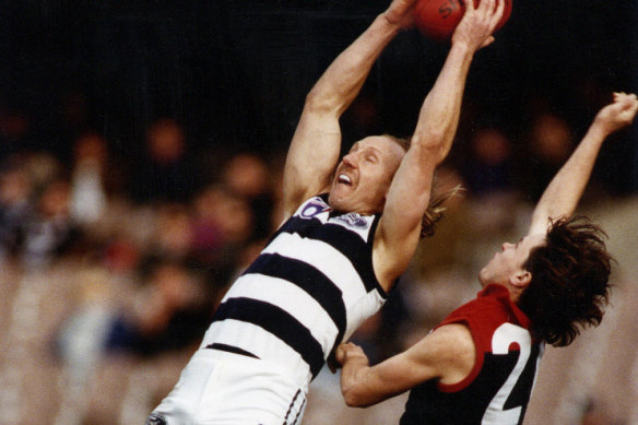 Gary Ablett leaps for a mark.