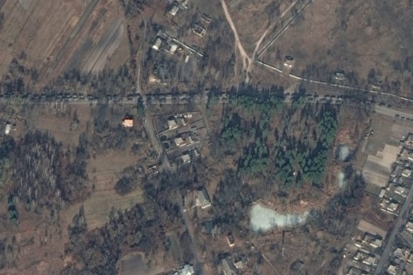 Russian vehicles on a road nearing Kyiv.