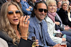 Andrew McLeod at the AFL grand final having a beer.