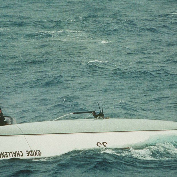 Bullimore emerges as HMAS Adelaide crew knock on the opposite side of the hull. This image was part of a folio that won the West Australian Press Photographer of the Year Awards for Tony McDonough, a Perth freelance photographer sent by Fairfax Media to cover the situation.