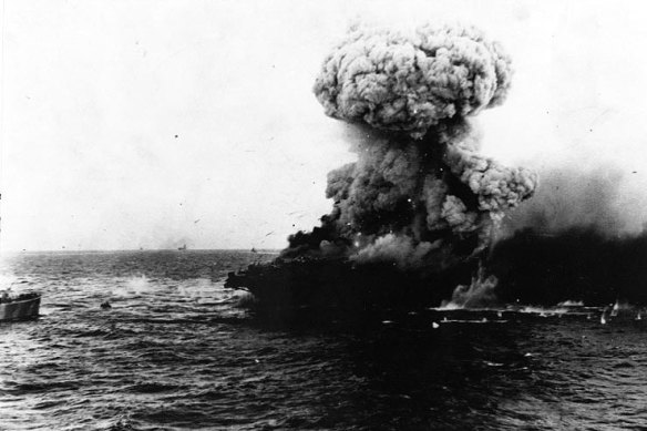 A mushroom cloud rises after a heavy explosion on board USS Lexington, 8 May 1942.