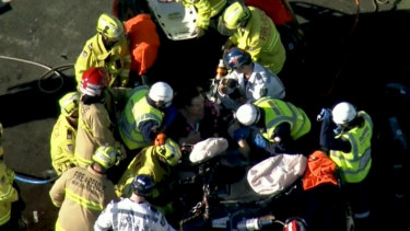 The BMW driver was freed from her vehicle by police rescue crews more than two hours.