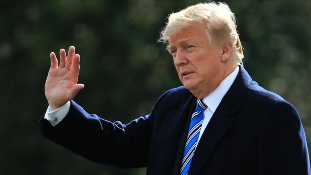 President Trump waves as he leaves the White House for a trip to his Mar-a-Lago estate in Palm Beach, Florida.