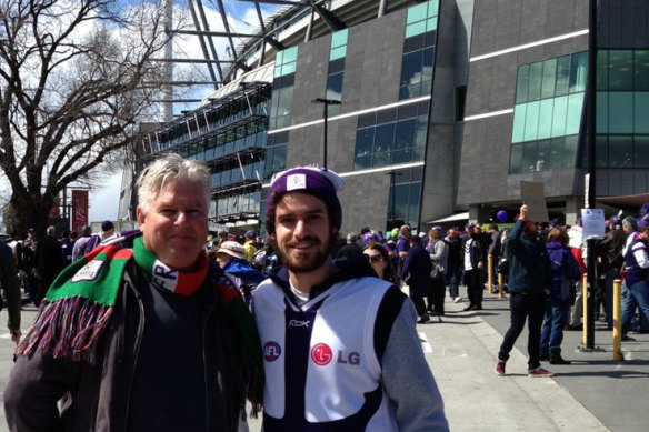 Israel Ostle and his father at the 2013 grand final.