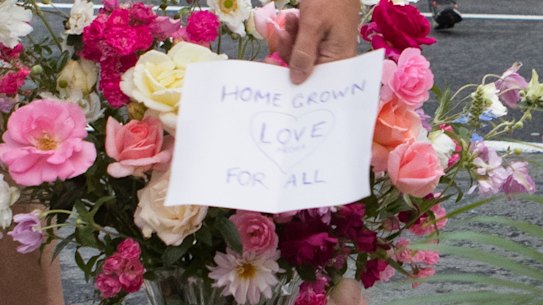 'Home grown love for all': Locals lay flowers near the Al Noor Mosque in Christchurch on Saturday morning.