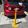 Bottle-o bollards block cars from leaving 15-minute parking spaces
