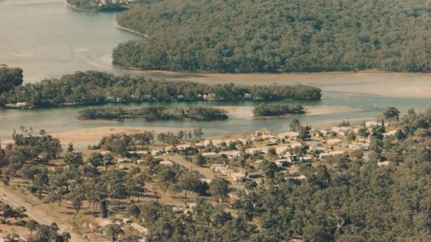 Chinamans Island, with the town of Lake Conjola in the foreground, in the 1970s or 1980s.