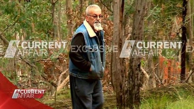 Video still shows Vasko Ristevski emerging from the scrub during filming of Nine's A Current Affair.