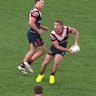 Latrell Mitchell crunches Toby Rodwell with a huge tackle.