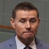 Member for Bowman, Andrew Laming, in discussion with Chief Government Whip Bert van Manen during a division in the House of Representatives at Parliament House in Canberra on  Thursday 3 June 2021. fedpol Photo: Alex Ellinghausen