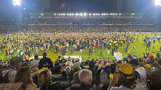 Fans invaded the pitch on the final whistle in Gosford.