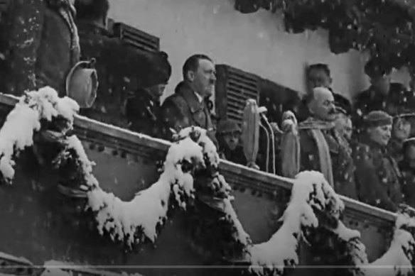 Hitler watches the opening of the 1936 Winter Olympics.