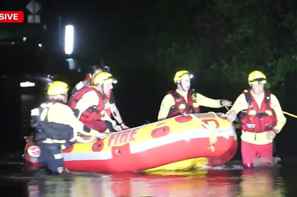 A woman was rescued from the roof of her car after she became caught in floodwater on the Sunshine Coast.