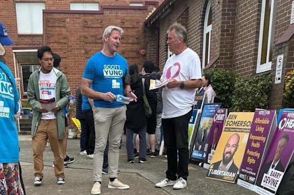 Gareth Hales, multimillionaire son of Plymouth Brethren Christian Church leader Bruce Hales, wears a blue Scott Yung campaign shirt at the Bennelong pre-polling booth on April 30.