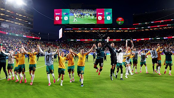 Australia celebrating after a goalless draw that put them in the knockout stage.