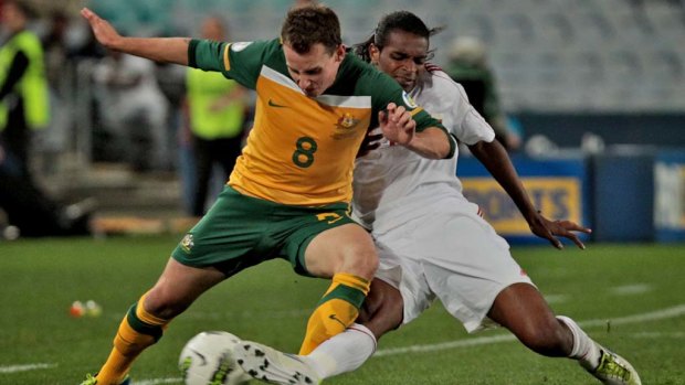 Luke Wilkshire playing for the Socceroos. 