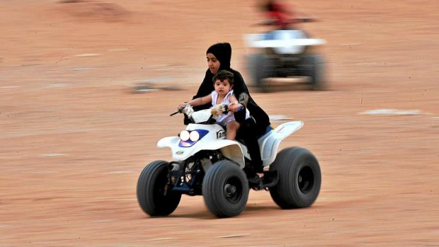 Saudi Arabia's religious police have lifted a ban on women riding bicycles and motorbikes, but only in recreational areas and while dressed in full Islamic veil, and accompanied by a male relative.