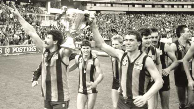 Hawthorn do a lap of honour with the cup after beating Melbourne in the 1988 grand final.