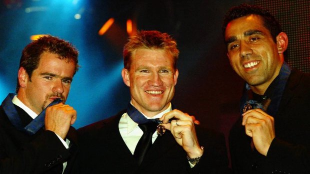 Nathan Buckley (centre), Mark Ricciuto (left) and Adam Goodes with their Brownlow Medals in 2003.