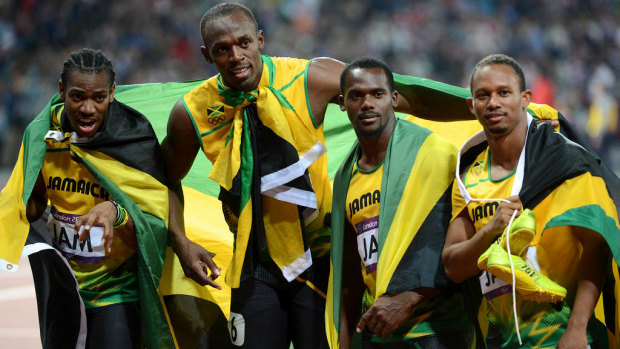 Jamaica's Yohan Blake, Usain Bolt, Nesta Carter and Michael Frater after  winning gold in the mens 4x100m relay final in Beijing.