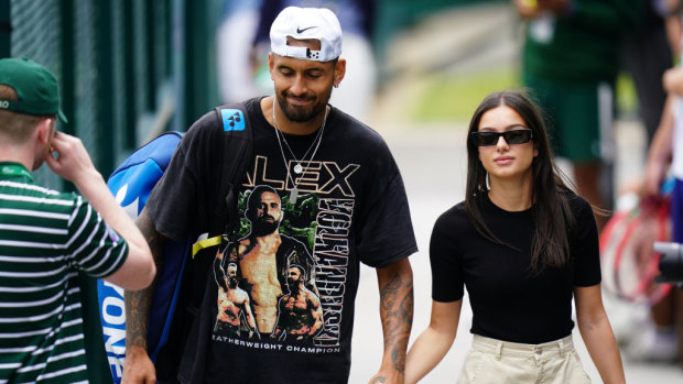 Kyrgios walking through Wimbledon with girlfriend Costeen Hatzi.