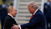 US President Donald Trump greets Russian President Vladimir Putin, on August 15, 2025, at Joint Base Elmendorf-Richardson, Alaska.