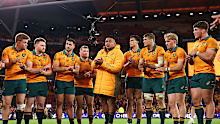 Allan Alaalatoa of the Wallabies speaks to teammates in a huddle.
