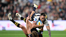Corey Toole of the Brumbies is tackled.